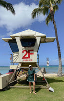Taylor standing in front of lifeguard tower
