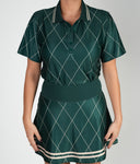 Model wearing the Pine Golf Polo - Green, featuring a modern fit with lightweight, moisture-wicking fabric and a stylish diamond pattern. Perfect for an elevated golf look.