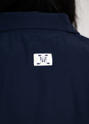 henslowe womens golf apparel logo on navy windbreaker